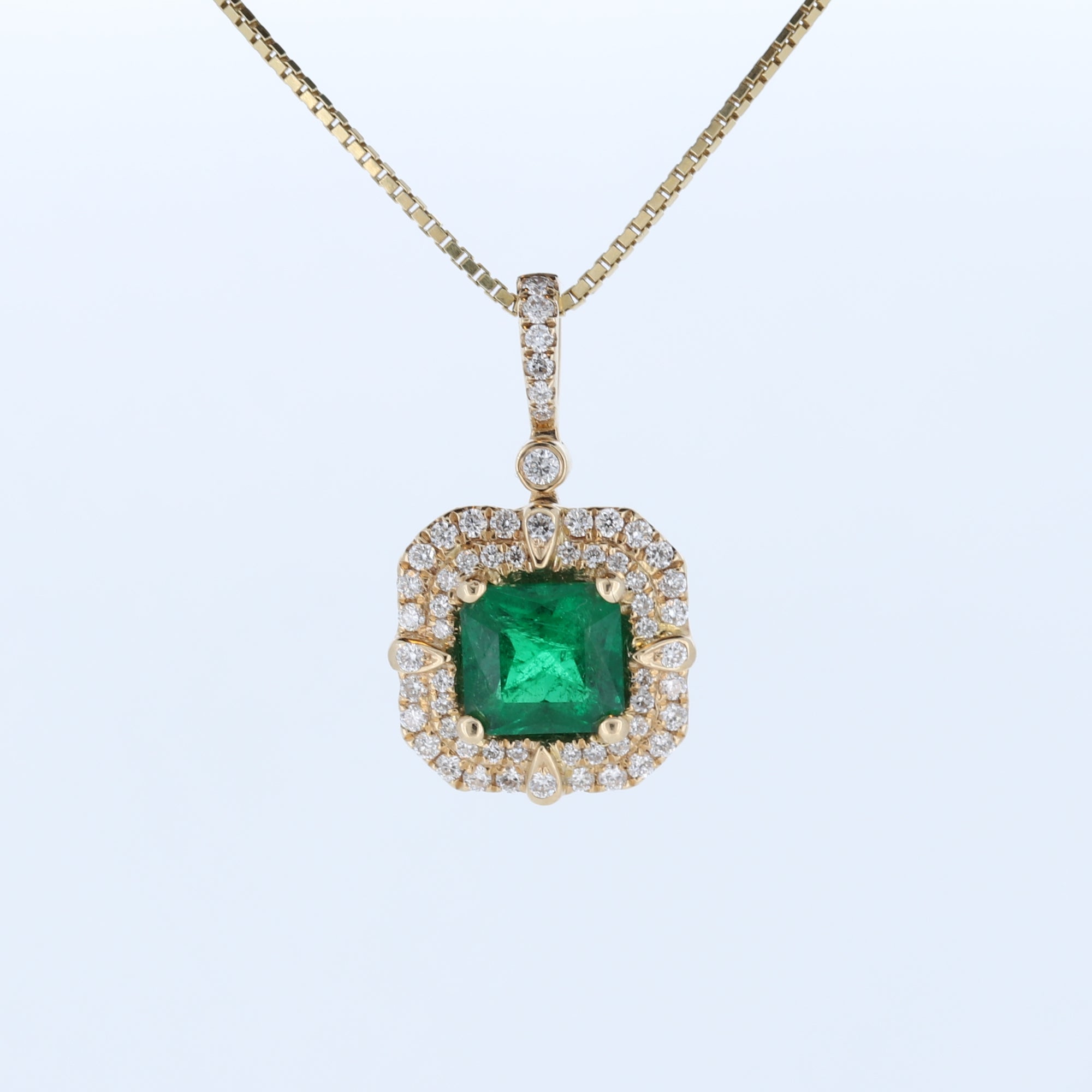 Cushion Emerald And Double Halo Diamond Pendant In 14Kt Yellow Gold