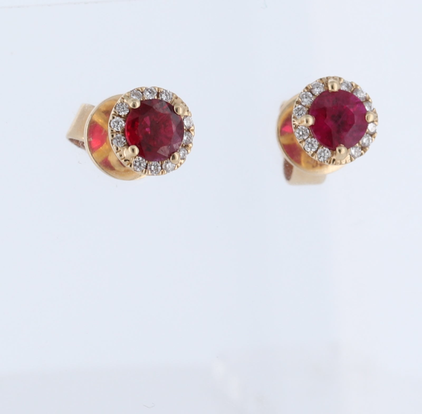 Round Ruby Halo Stud Earrings In 14Kt Yellow Gold