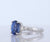 Platinum Sapphire Three Stone Ring With Center Oval And Half Moon Cut Diamond Sides