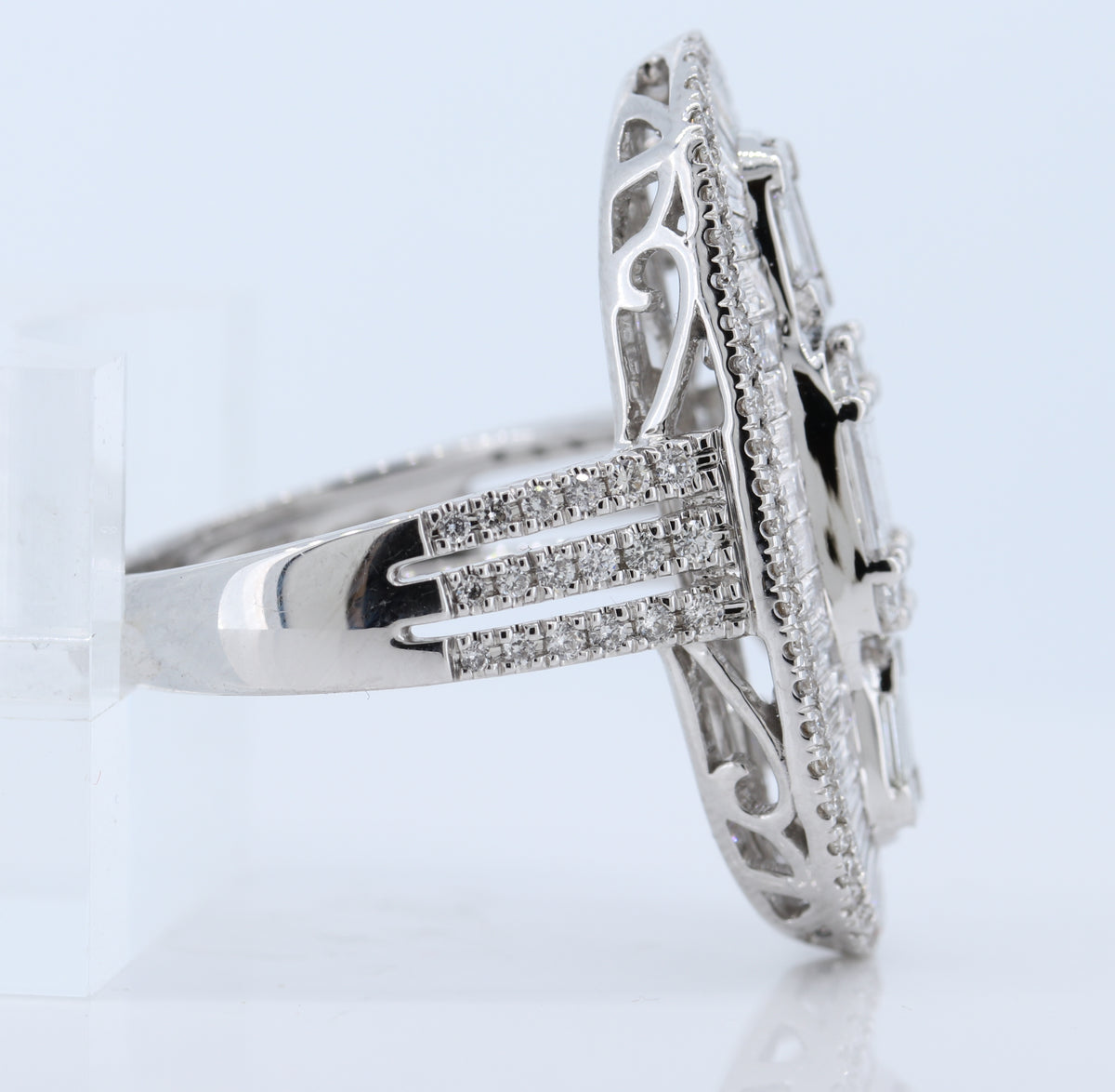 18Kw Elongated Oval Diamond Ring With Round And Step Emerald Cut Diamonds. D-2.65