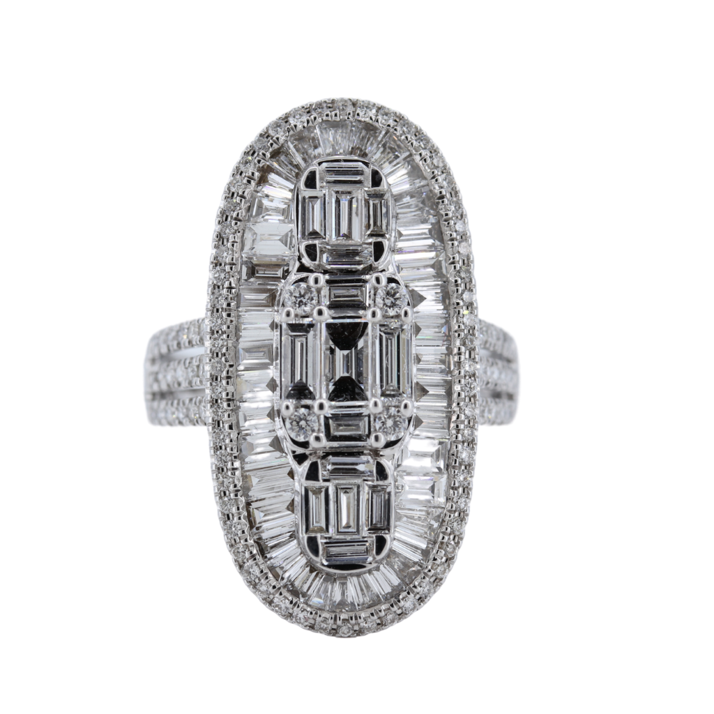 18Kw Elongated Oval Diamond Ring With Round And Step Emerald Cut Diamonds. D-2.65