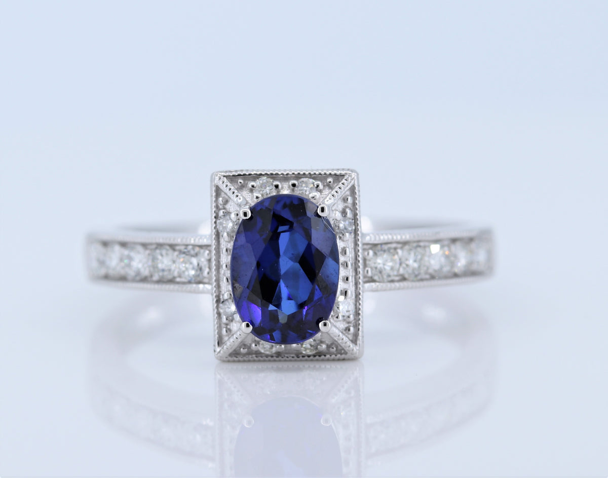 1 Carat Sapphire Ring w Diamond halo in 14kt White Gold