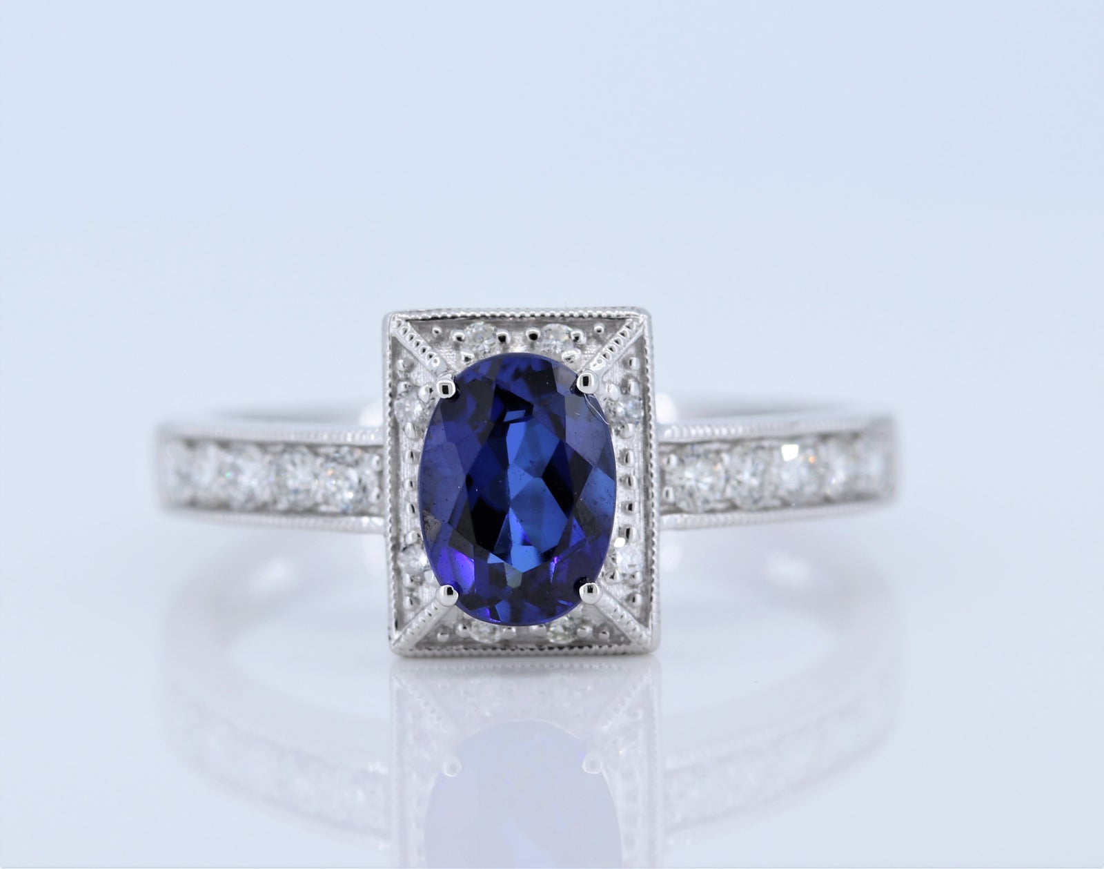 1 Carat Sapphire Ring w Diamond halo in 14kt White Gold
